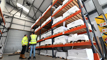 Battery recycling process - Tall shelves full of battery floorplans waiting to start the process