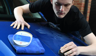 Cleaning product test on car bonnet