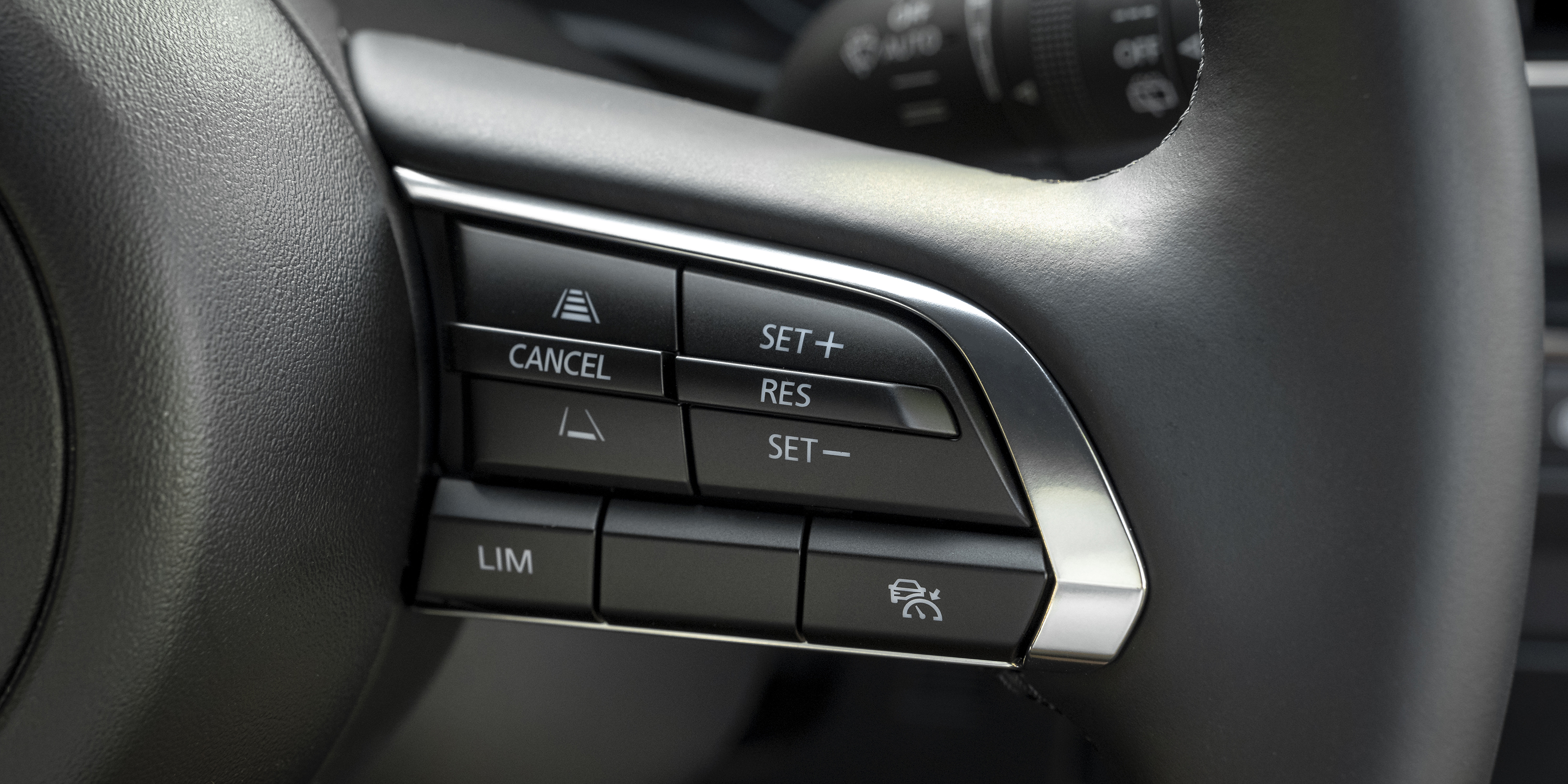 Mazda 3 steering wheel cruise control buttons