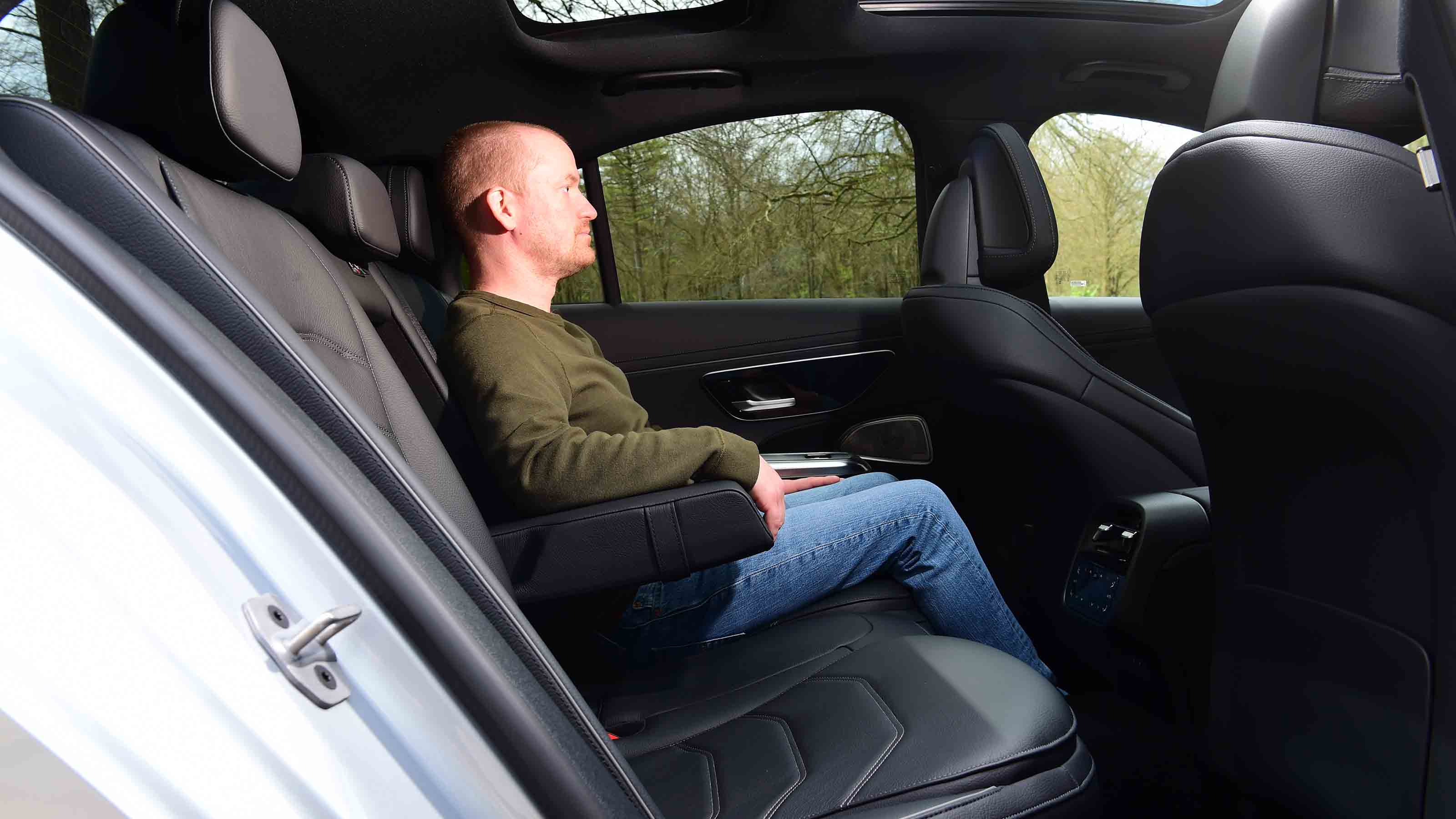 Alex Ingram sitting in the Mercedes E-Class's rear seat