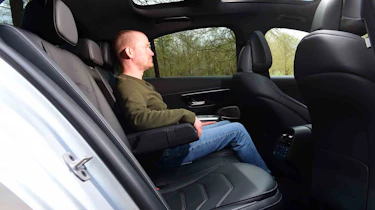 Alex Ingram sitting in the Mercedes E-Class's rear seat