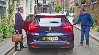 Out-going Renault UK boss Guillaume Sicard and John McIlroy getting into the back of a Renault Scenic