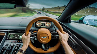 Aston Martin DB12 driving shot from interior