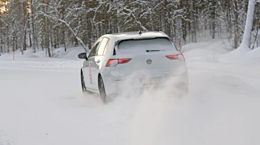VW Golf in snow - rear