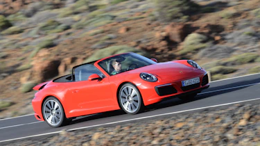 Porsche 911 Carrera S 2015 front tracking red