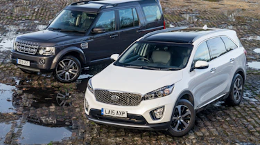 Used Range Rover Discovery 4 vs New Kia Sorento - front