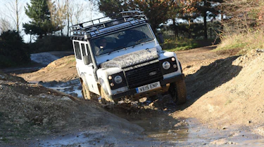 Land Rover Defender vs Toyota Land Cruiser - Defender front off road
