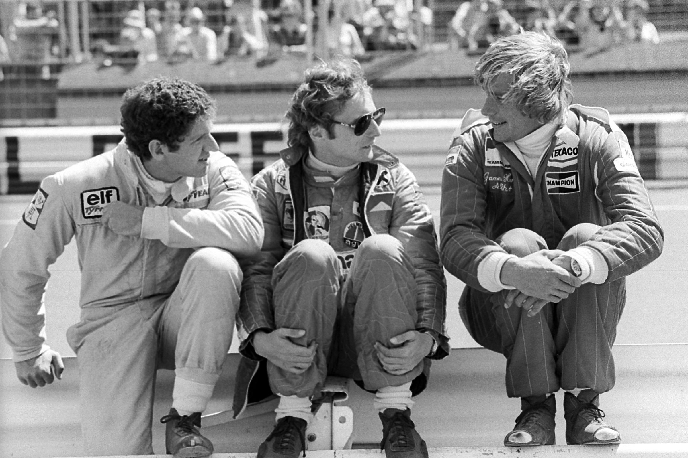 Jody Scheckter talks with Niki Lauda and race winner ￼Hunt at the 1976 German Grand Prix