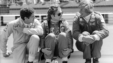 Jody Scheckter talks with Niki Lauda and race winner Hunt at the 1976 German Grand Prix