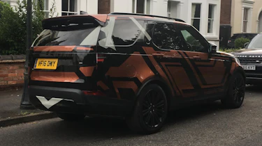 Land Rover Discovery 2017 - spy shot orange rear quarter 2