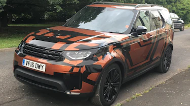 Land Rover Discovery 2017 - spy shot orange front quarter