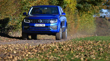 Volkswagen Amarok pick-up 2016 - driving leaves
