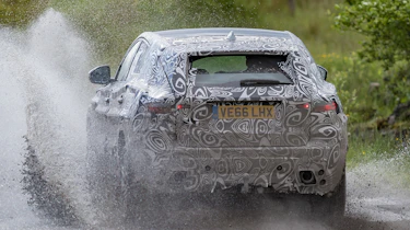 Jaguar E-Pace official spy shot cold off-road