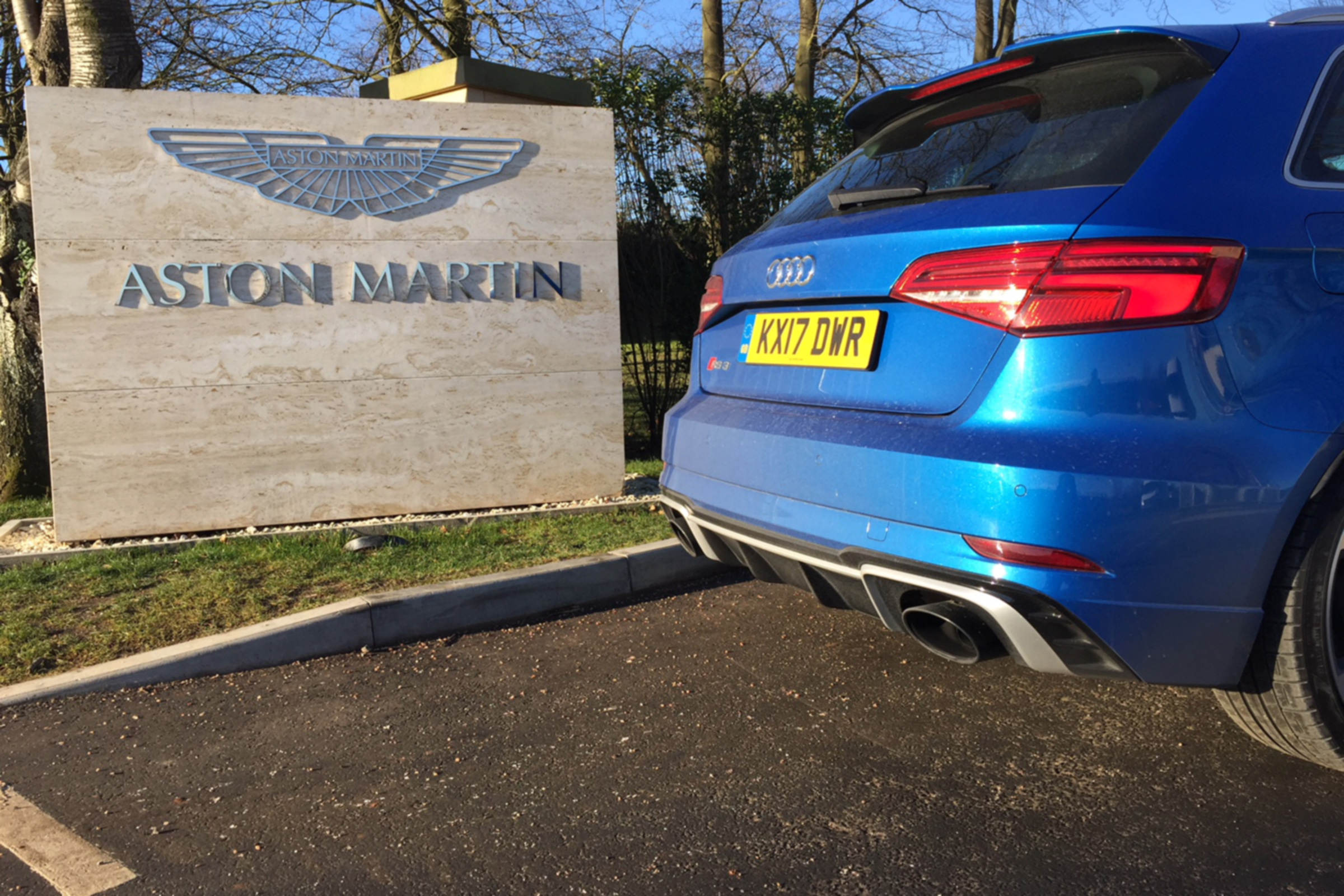 Audi RS3 outside Aston Martin HQ