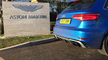 Audi RS3 outside Aston Martin HQ