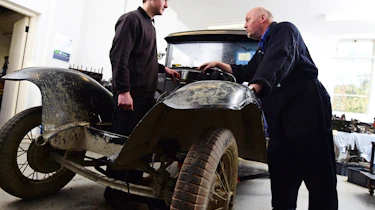 Classic car with mechanics