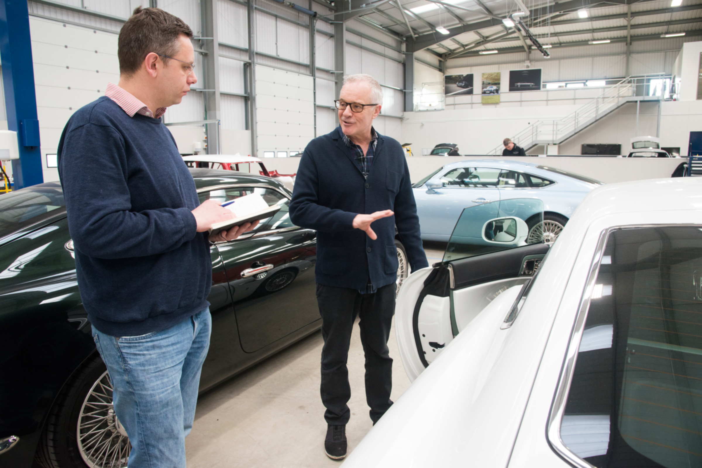 Hugo Griffiths and David Brown inspect cars