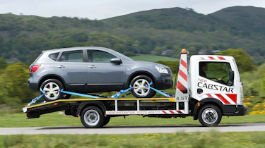Flatbed van brokendown car