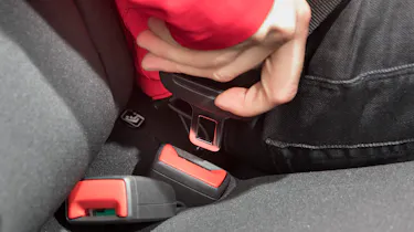 Seat belt being fastened