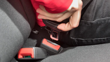 Seat belt being fastened
