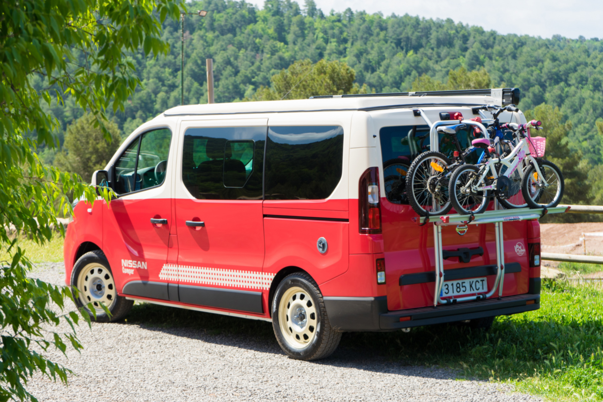 Red Nissan campervan