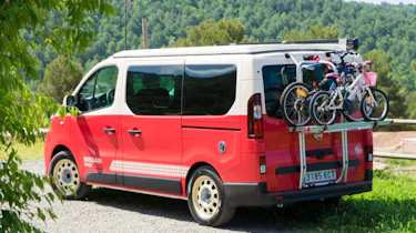 Red Nissan campervan