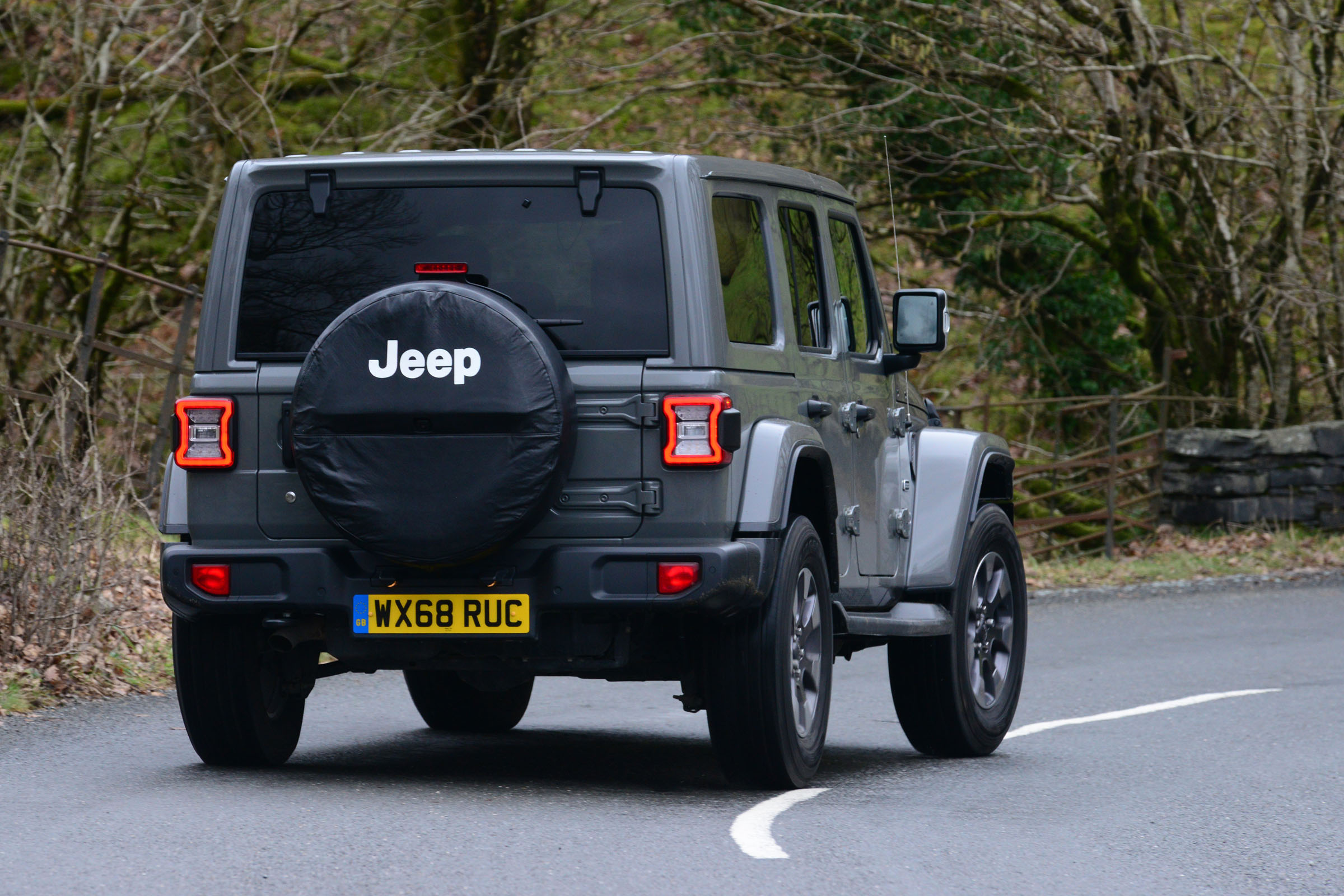 Jeep Wrangler driving rear