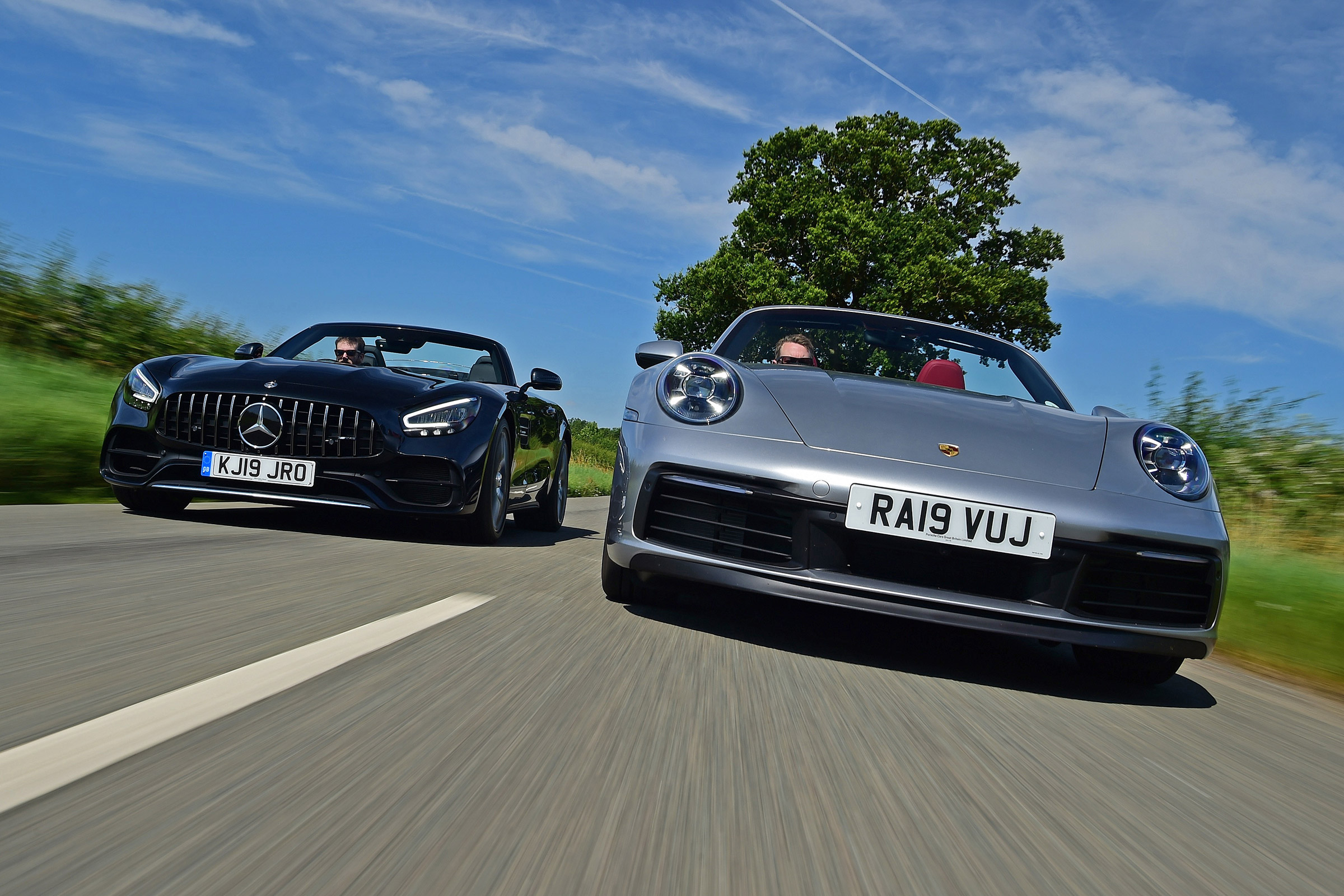 Porsche 911 Cabriolet vs Mercedes-AMG GT Roadster - header