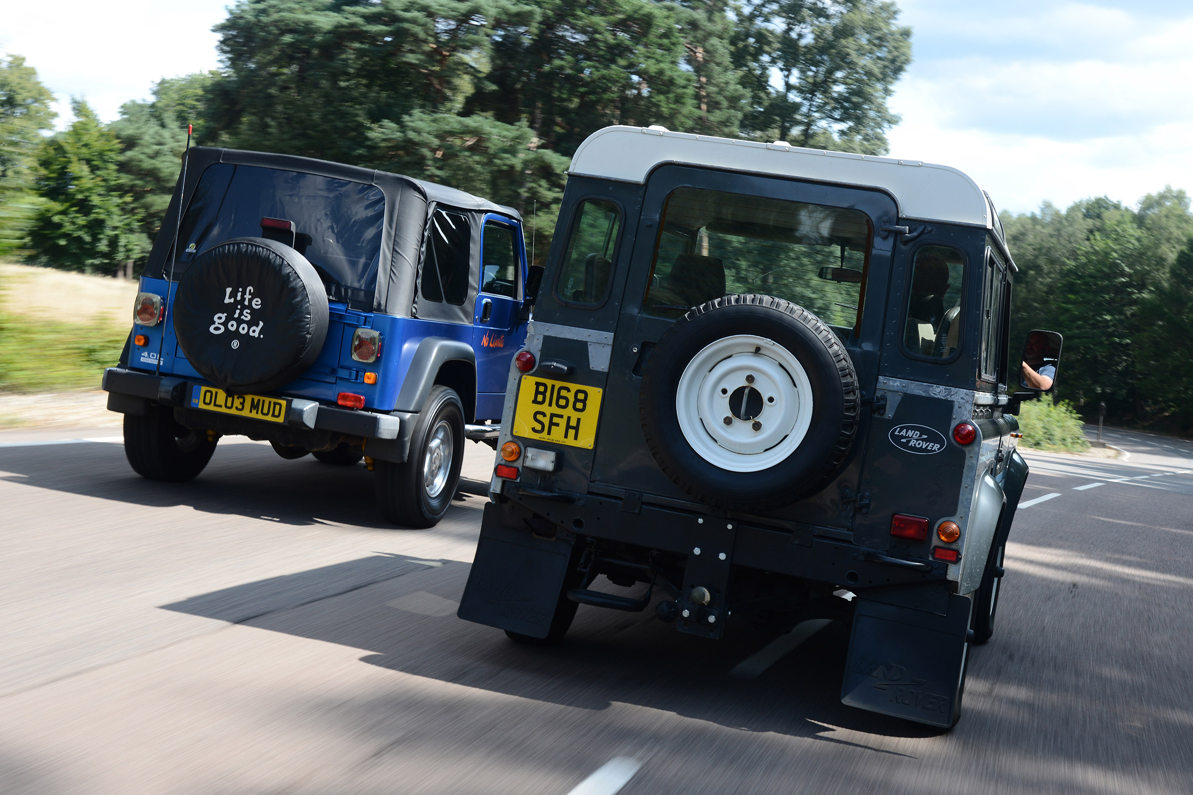 Land Rover Defender vs Jeep Wrangler - modern classics rear head-to-head
