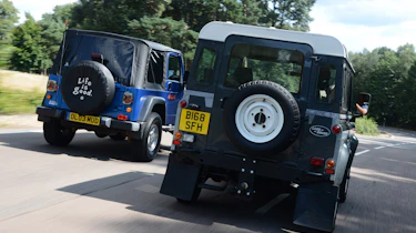 Land Rover Defender vs Jeep Wrangler - modern classics rear head-to-head