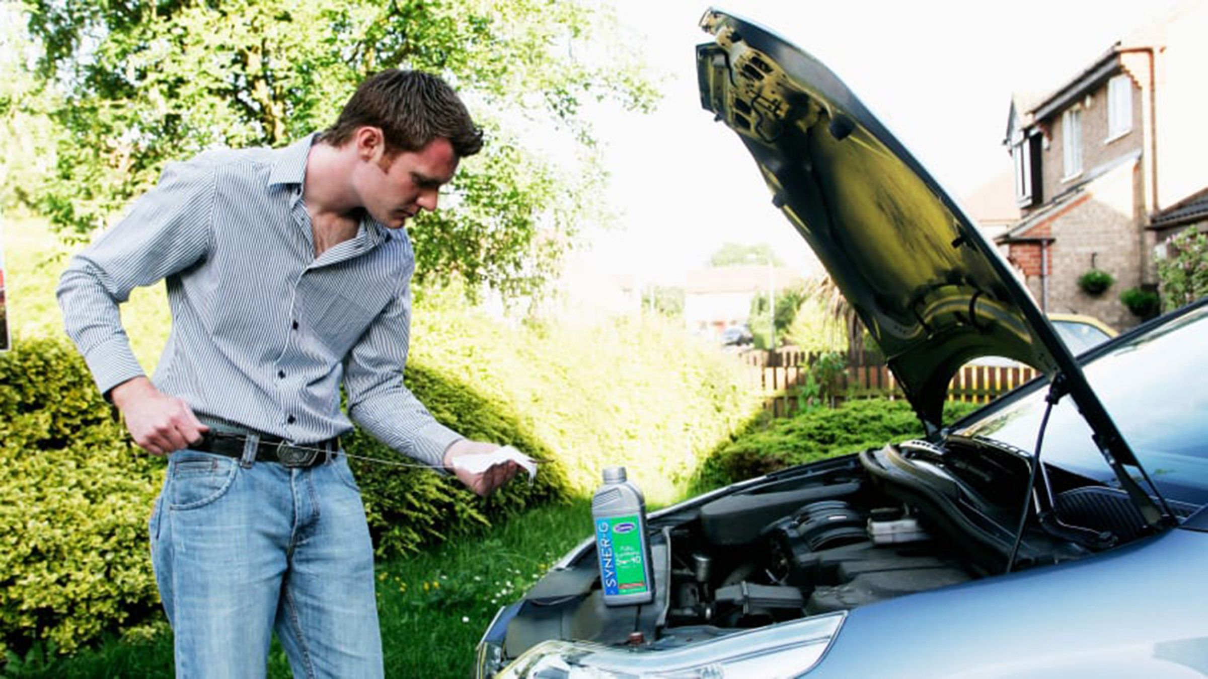 Person checking their car's oil level