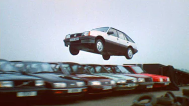 Vauxhall Cavalier (Mk2) jumping over a number of other cars