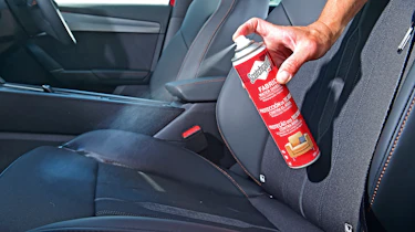 Fabric protector test - spraying a seat