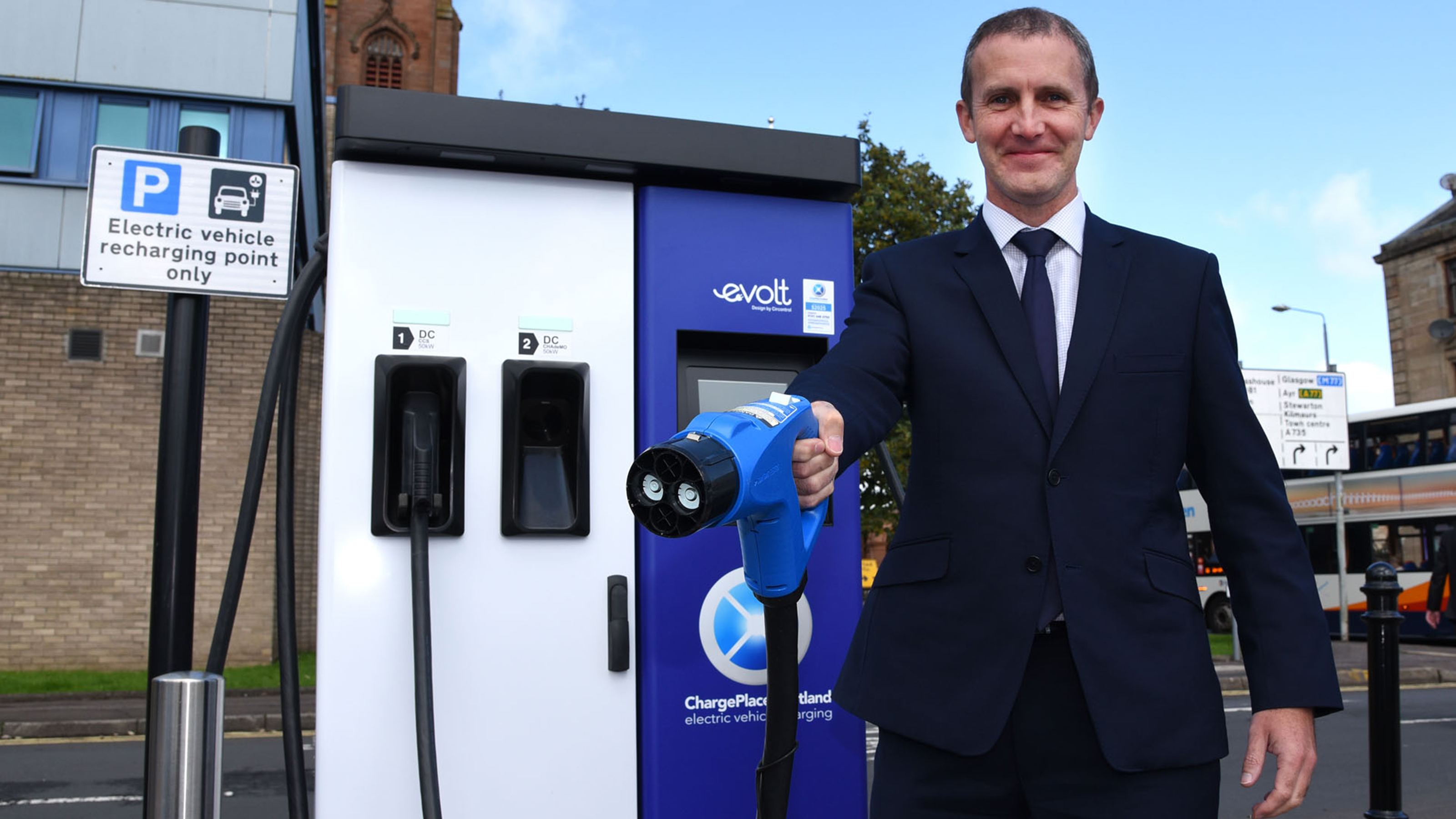 Michael Matheson MSP holding Chargeplace Scotland charger