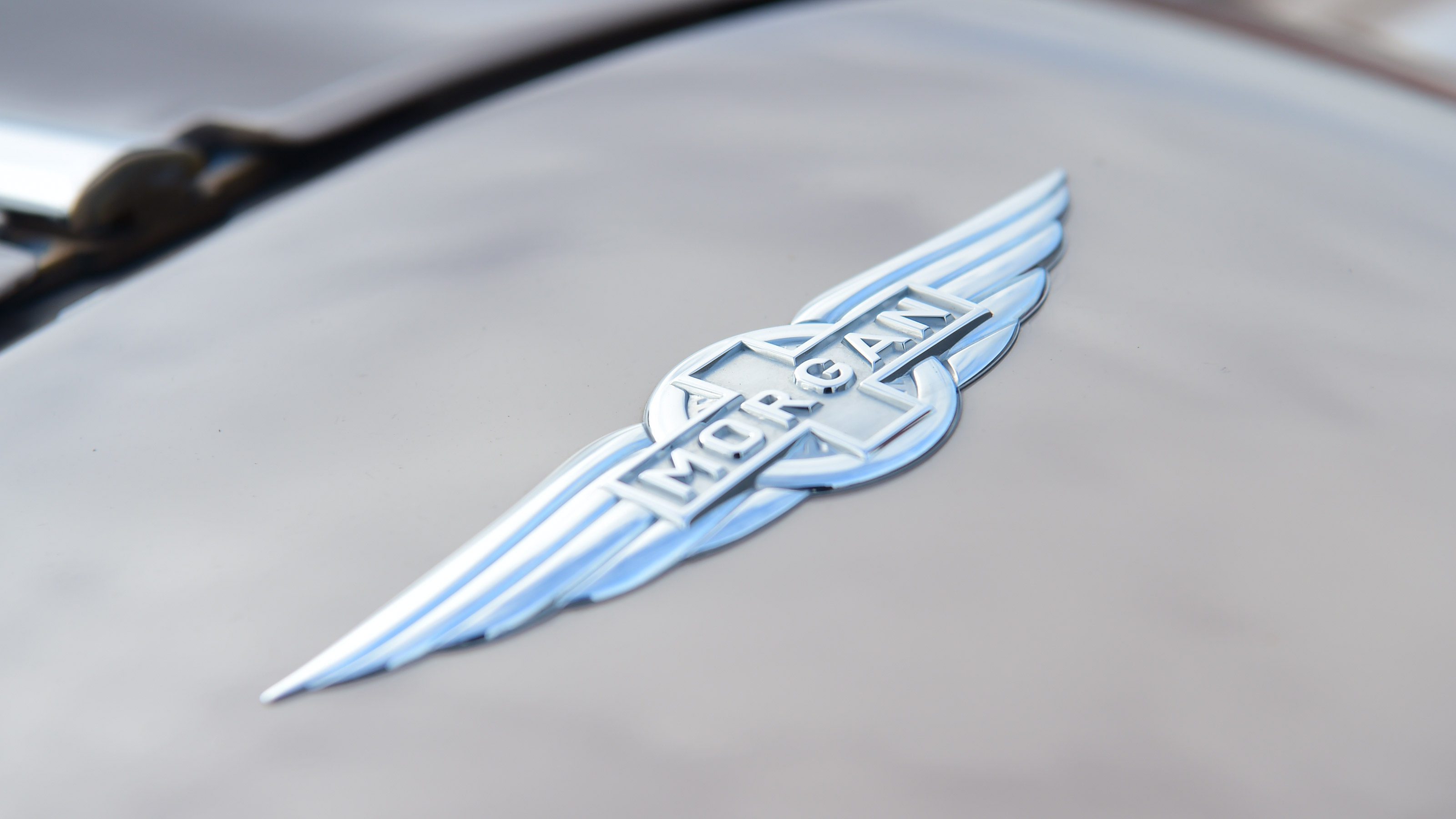 Morgan Plus Four CX-T - badge