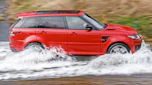 Range Rover driving through ford