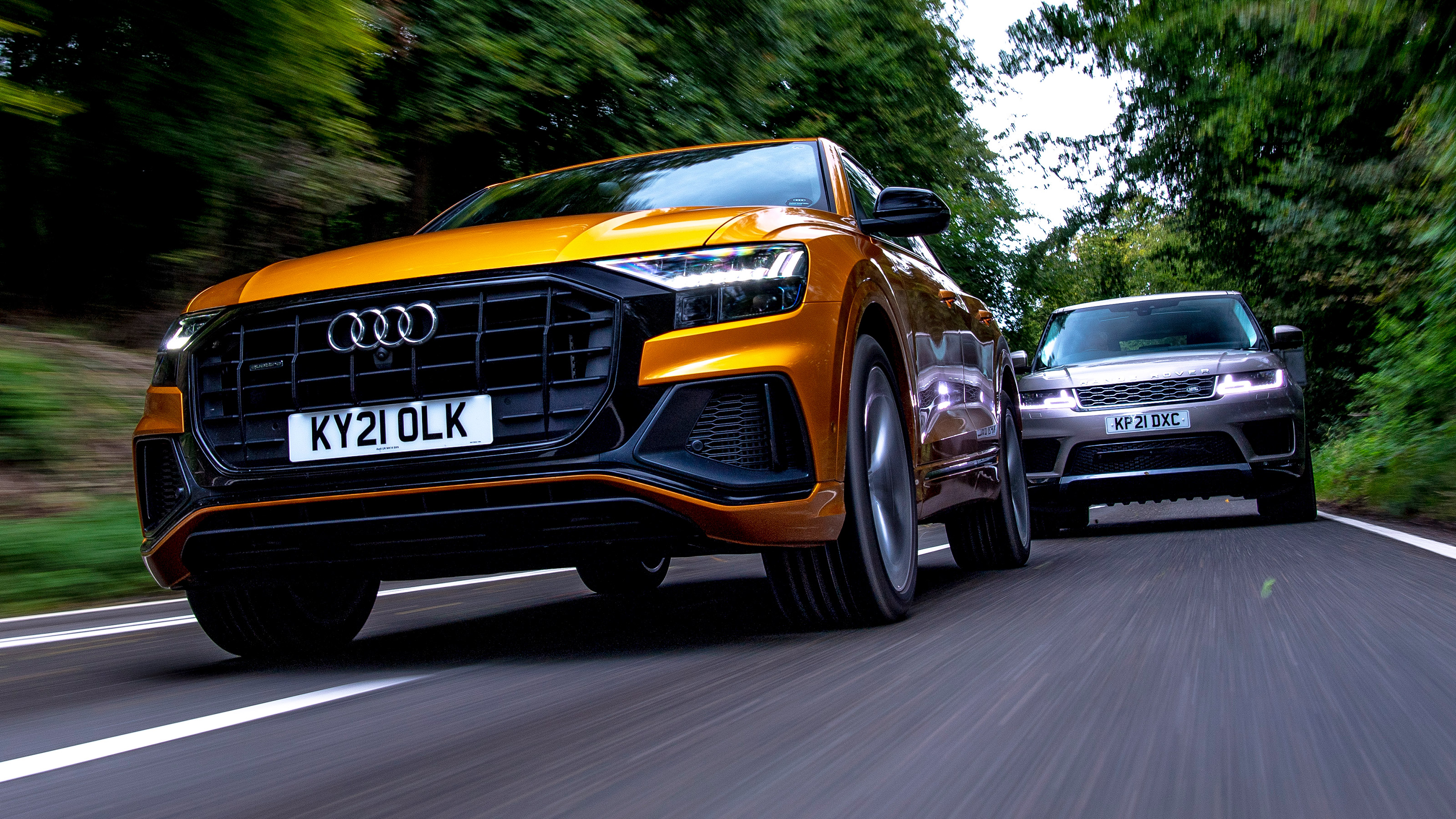 Audi Q8 55 TFSI e vs Range Rover Sport P400e - front
