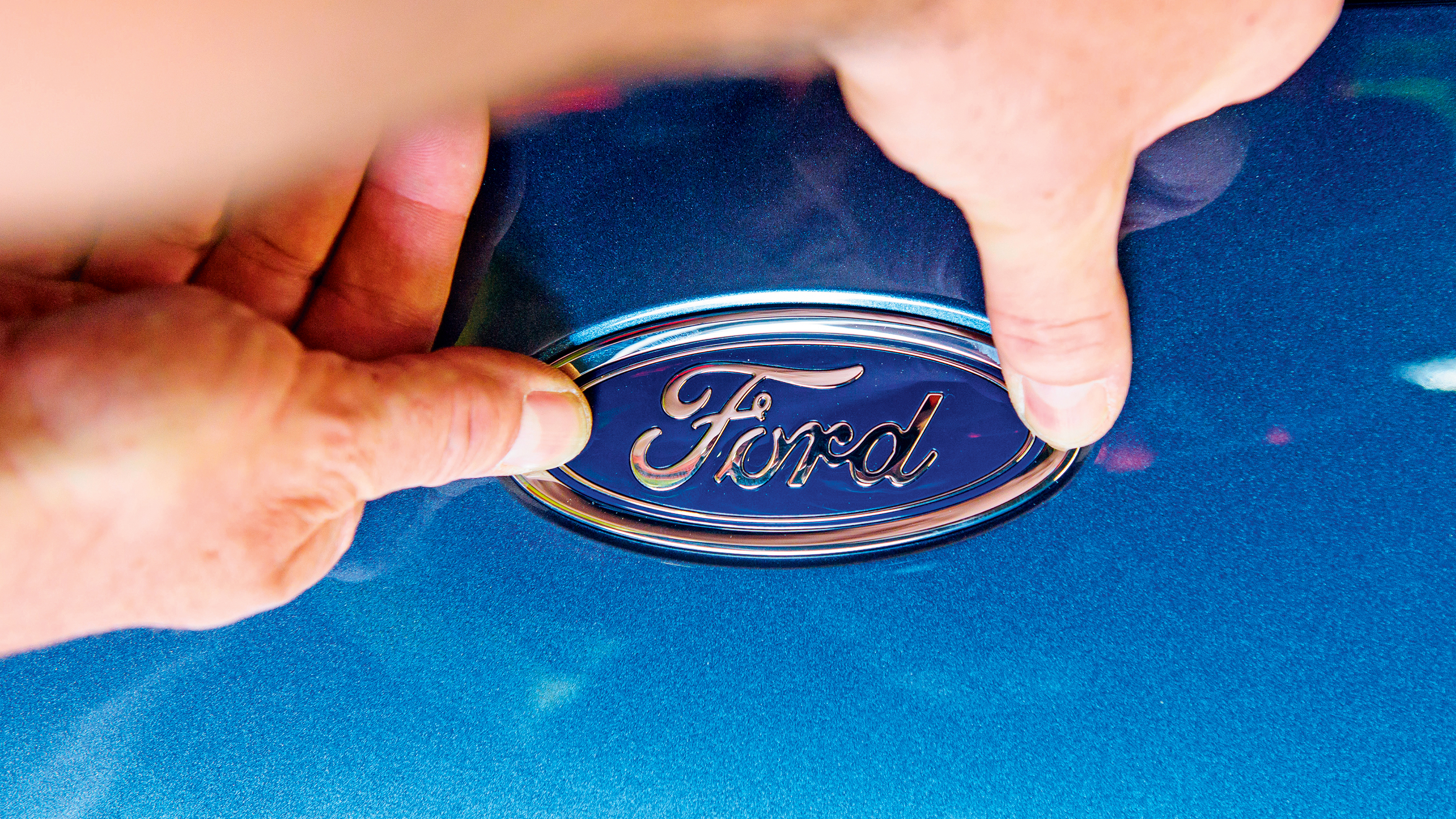 Ford badge being applied