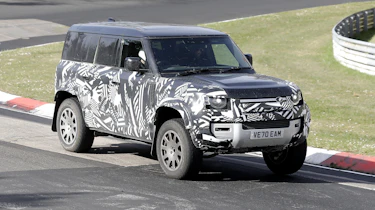 Land Rover Defender V8 spy shots front 3/4