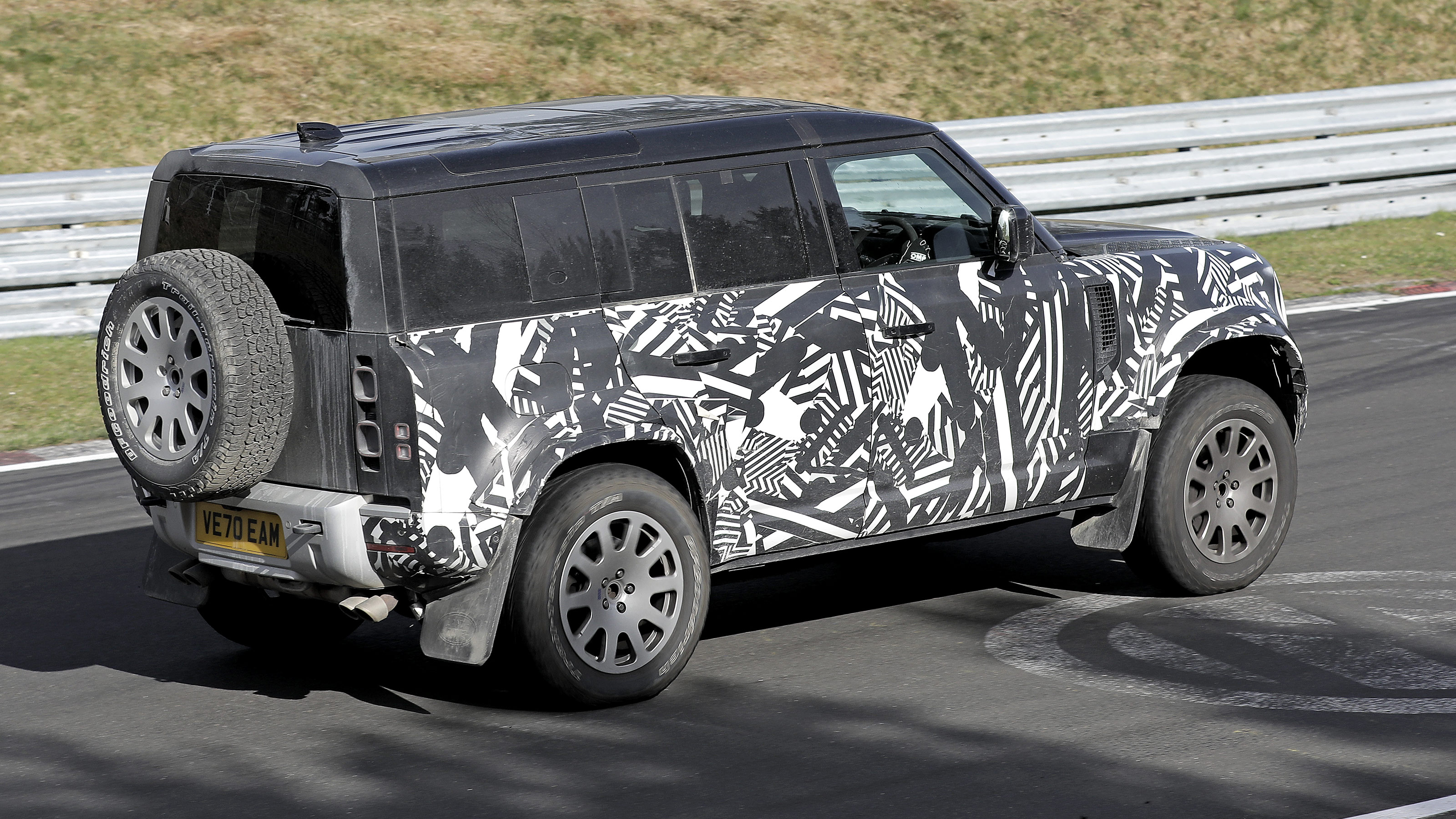 Land Rover Defender V8 spy shots rear side