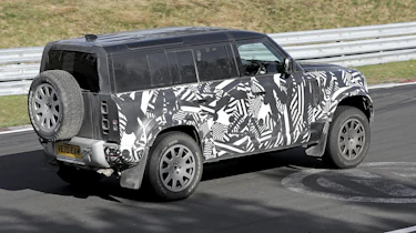 Land Rover Defender V8 spy shots rear side