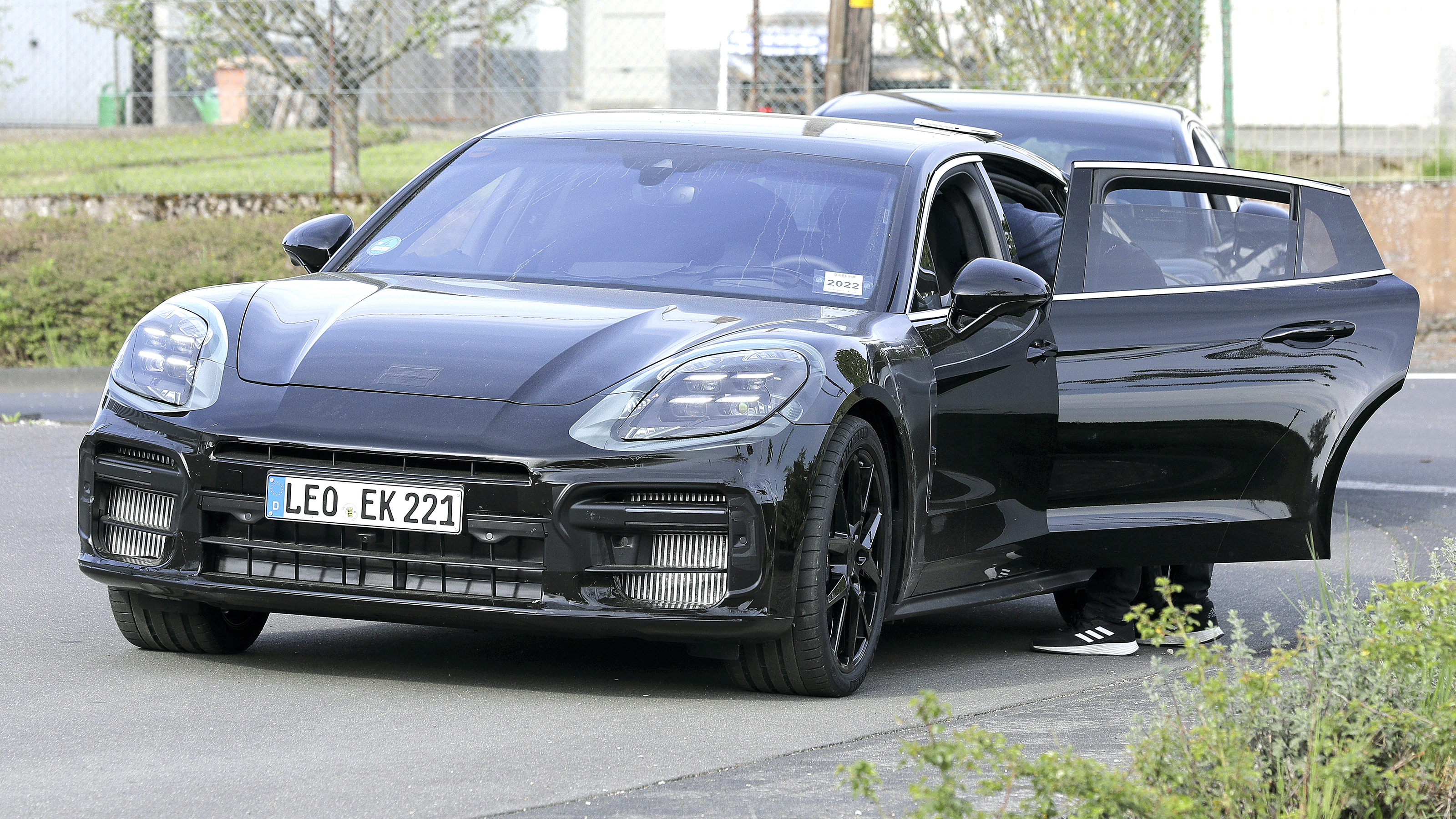 2024 Porsche Panamera spyshot - front static with rear door open
