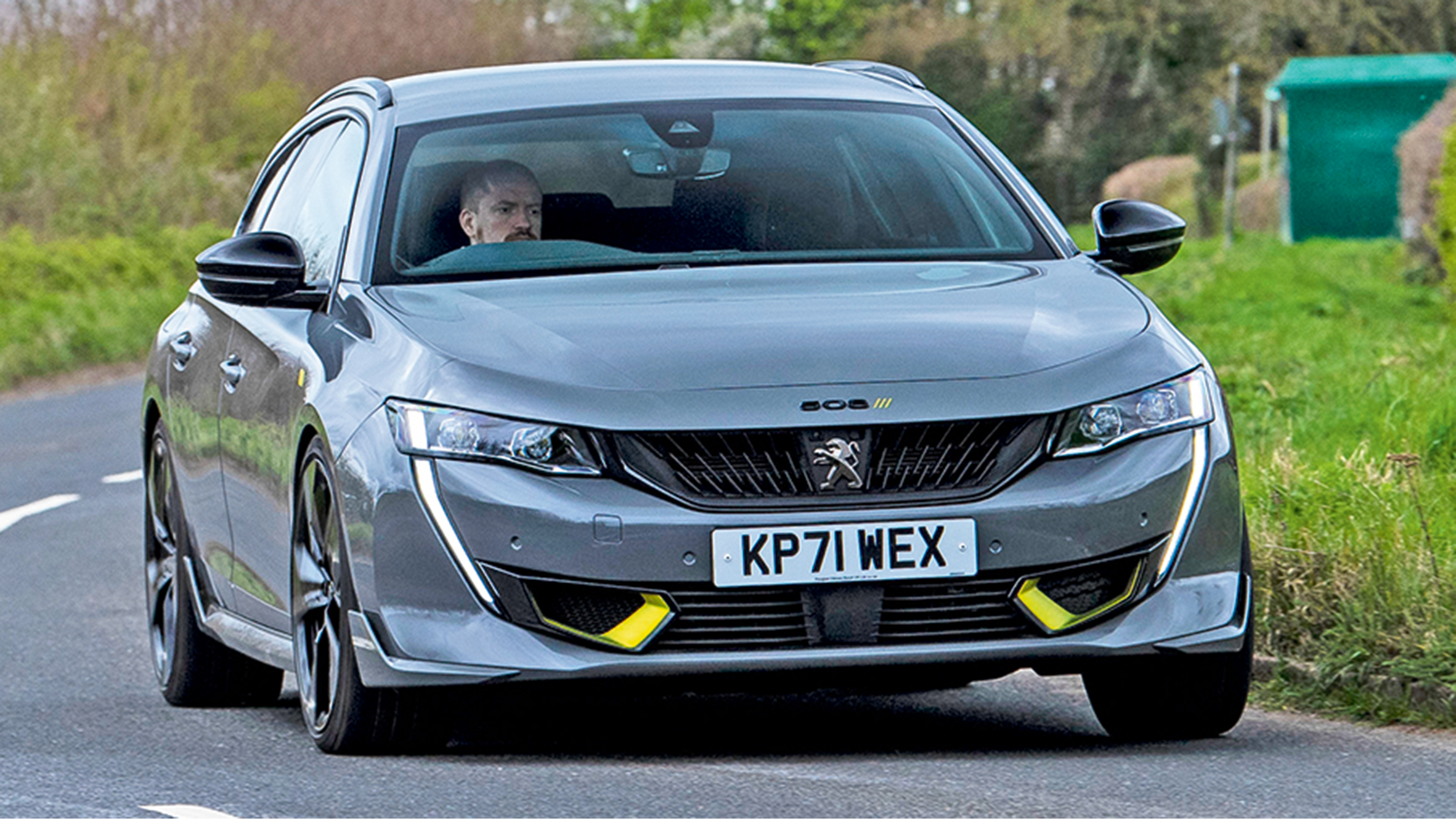Peugeot 508 SW Sport Engineered vs BMW 330e xDrive Touring - 508 front cornering