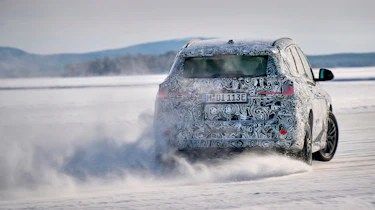 BMW iX1 winter testing - snow drifting rear