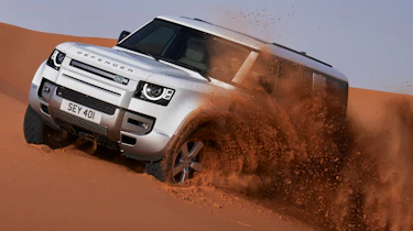Land Rover Defender 130 on sand dune