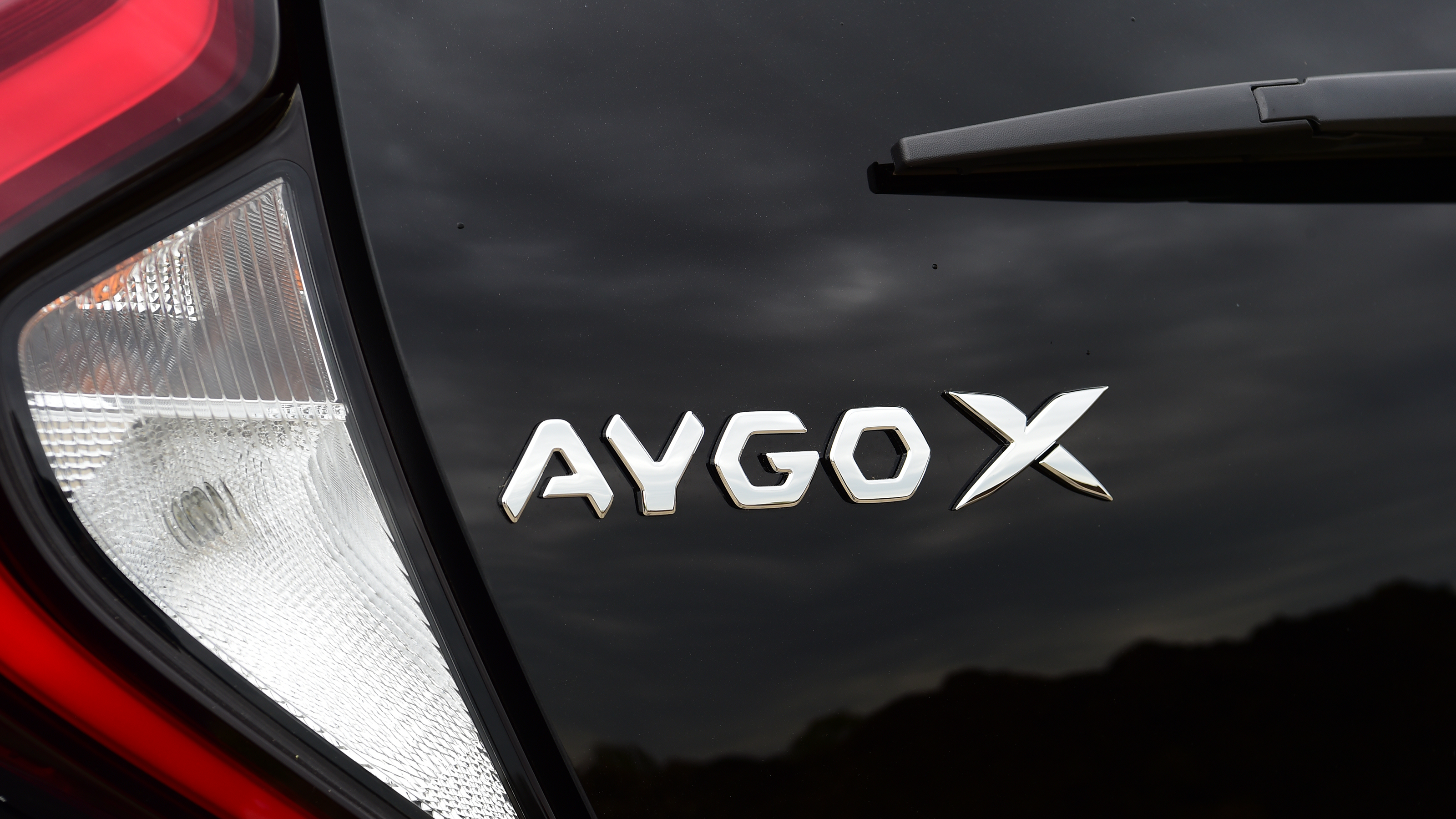 Toyota Aygo X vs Hyundai i10 vs Fiat 500 group test - Toyota Aygo X rear badge