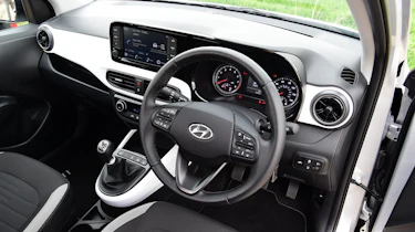 Toyota Aygo X vs Hyundai i10 vs Fiat 500 group test - Hyundai i10 interior from driver's door