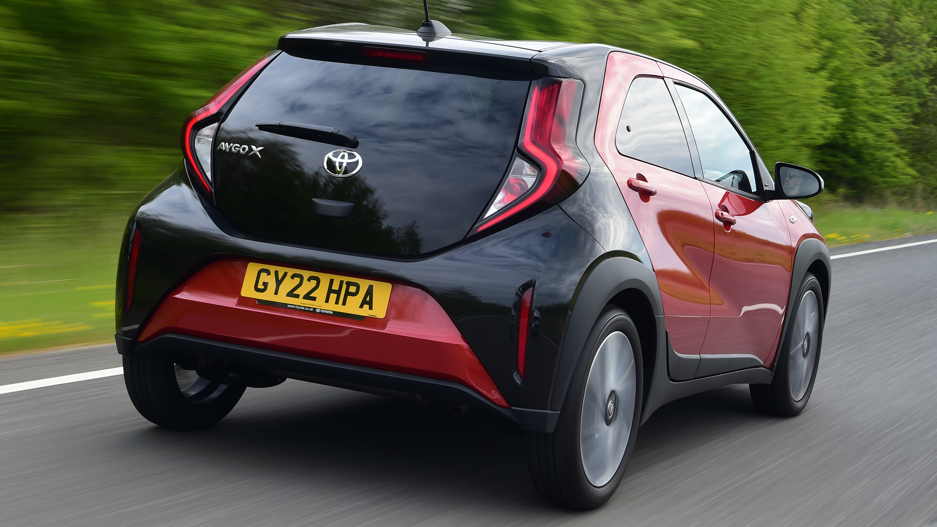 Toyota Aygo X vs Hyundai i10 vs Fiat 500 group test - Toyota Aygo X rear tracking