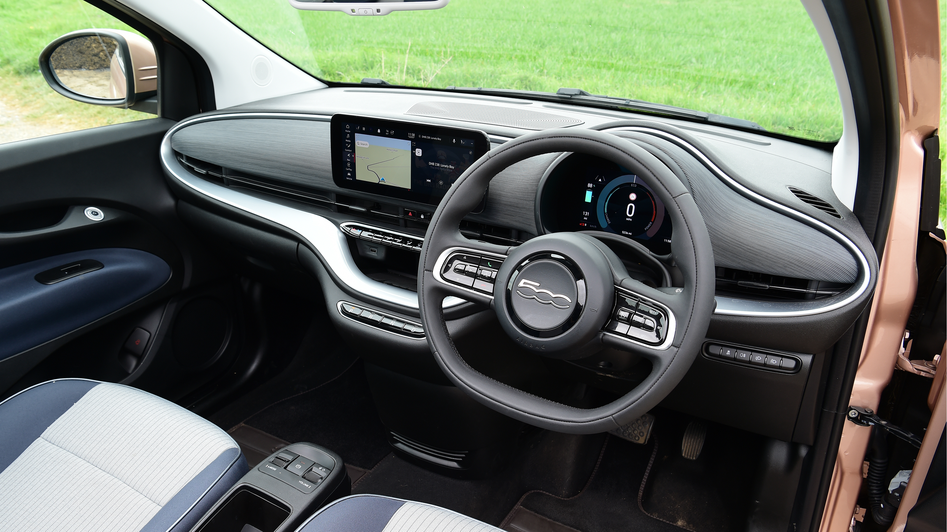 Toyota Aygo X vs Hyundai i10 vs Fiat 500 group test - Fiat 500 interior from driver's door