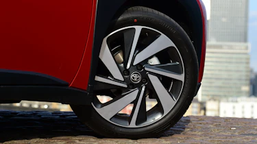 Toyota Aygo X vs Hyundai i10 vs Fiat 500 group test - Toyota Aygo X front O/S wheel